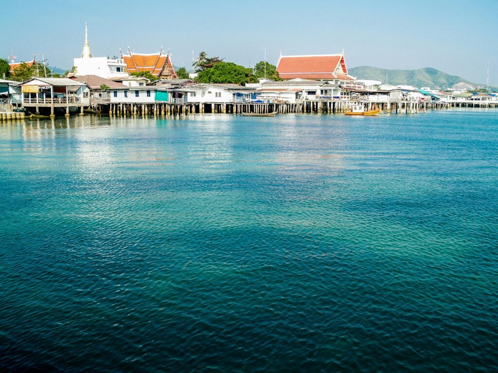 A serene view of the coastal town in Sattahip, Thailand with traditional architecture by the sea.