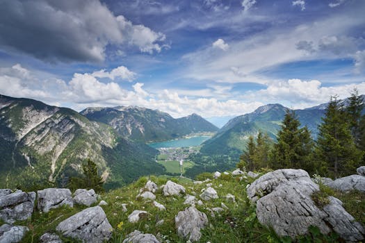 Majestic view of Pertisau in Tirol, Austria, with lush valleys and alpine lakes.