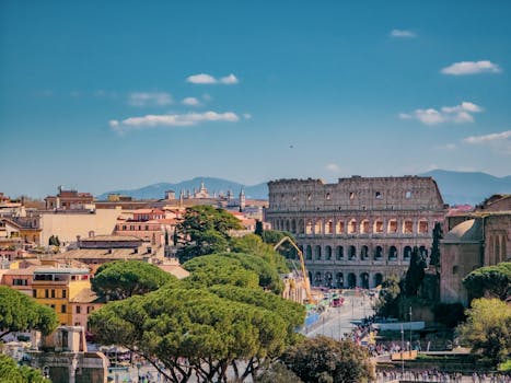 A breathtaking view of Rome featuring the iconic Colosseum on a sunny day.